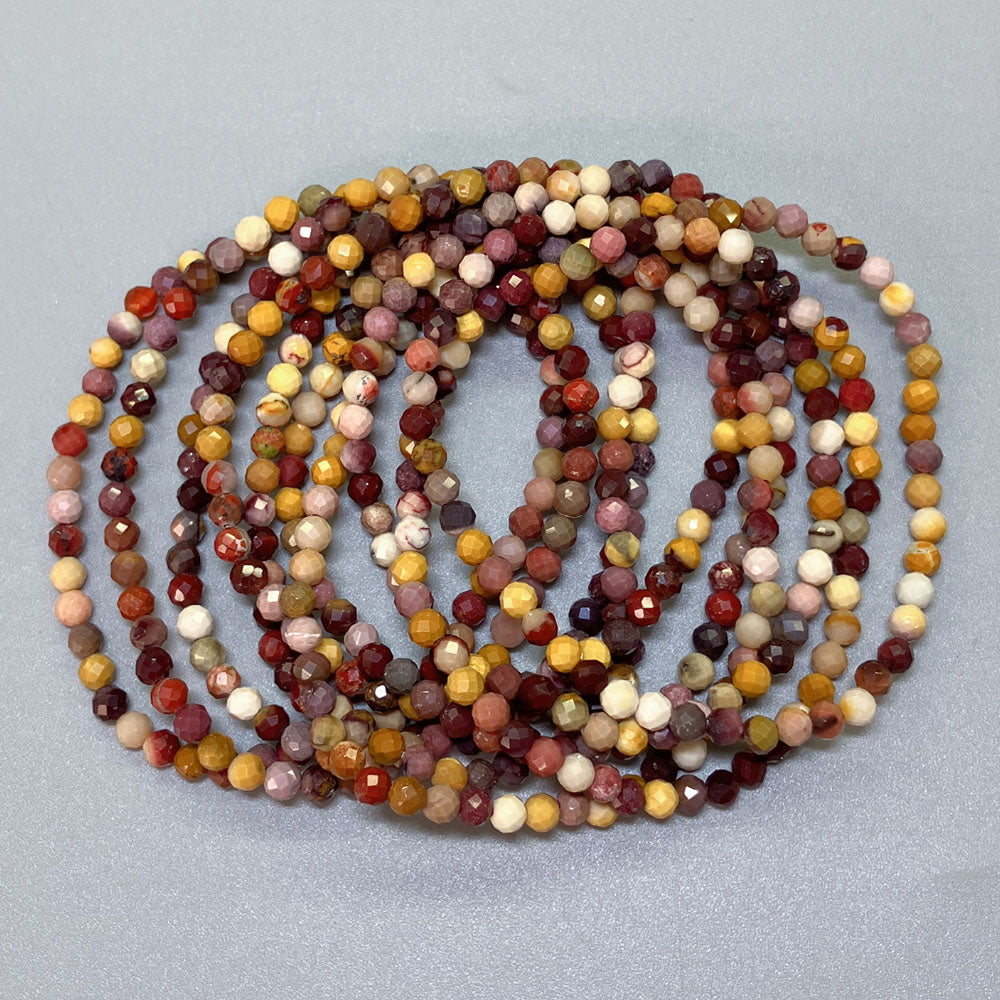 2b10c320953a1574f470173580876641_e2a5e00e-3566-42c8-afa1-27b44437ab10 Mookaite Faceted Round Bracelet 4mm A