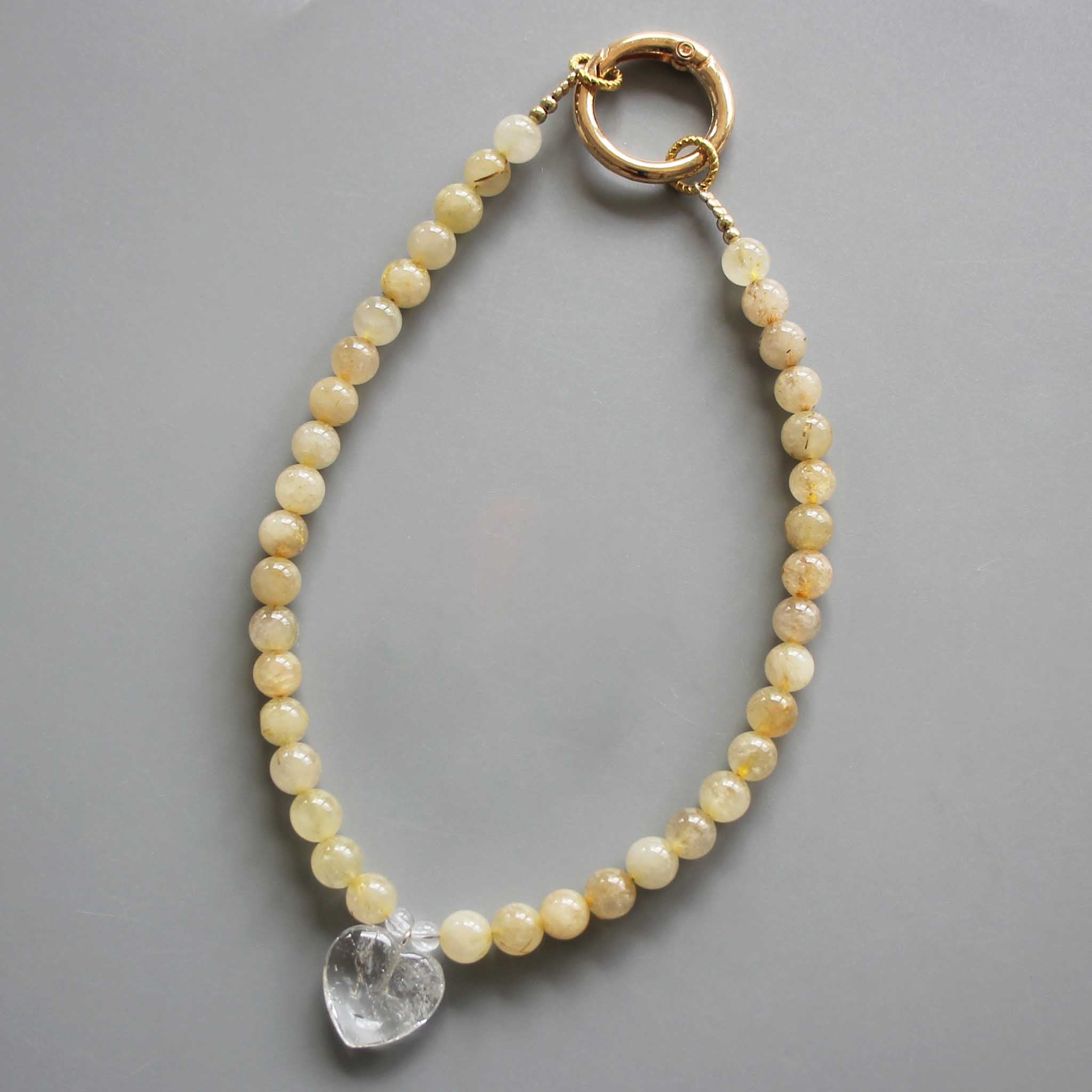4aebe8e9f2958d7b4dcc4ac5e1b864ce-1 Gold Rutile Quartz Round Bead Phone Cord 6mm A/B