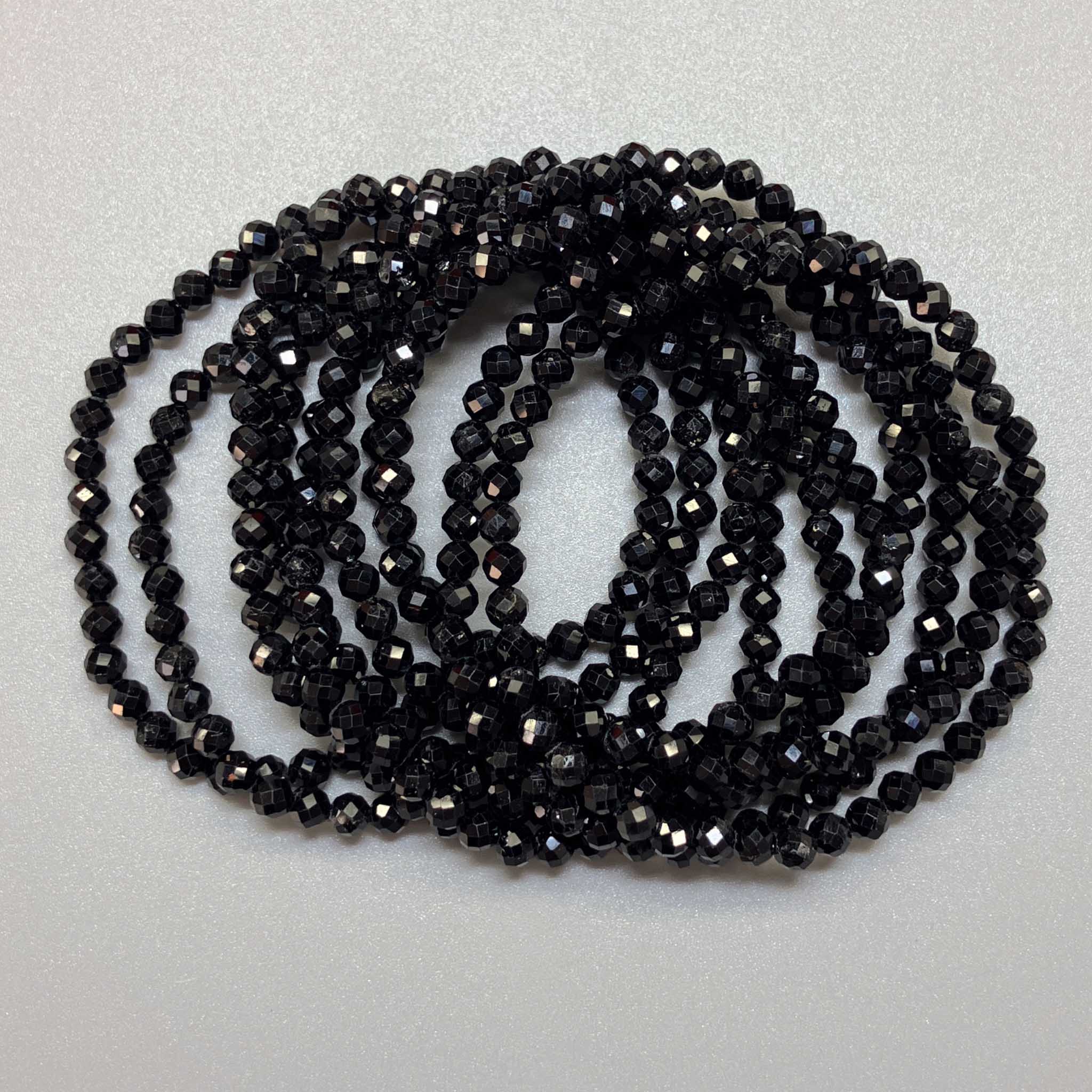 7ec390f02381b08d01738ac935cb7f4a_31502cfa-30e1-4ef9-847f-fca6bd9ed115 Black Tourmaline Faceted Round Bracelet 4mm A