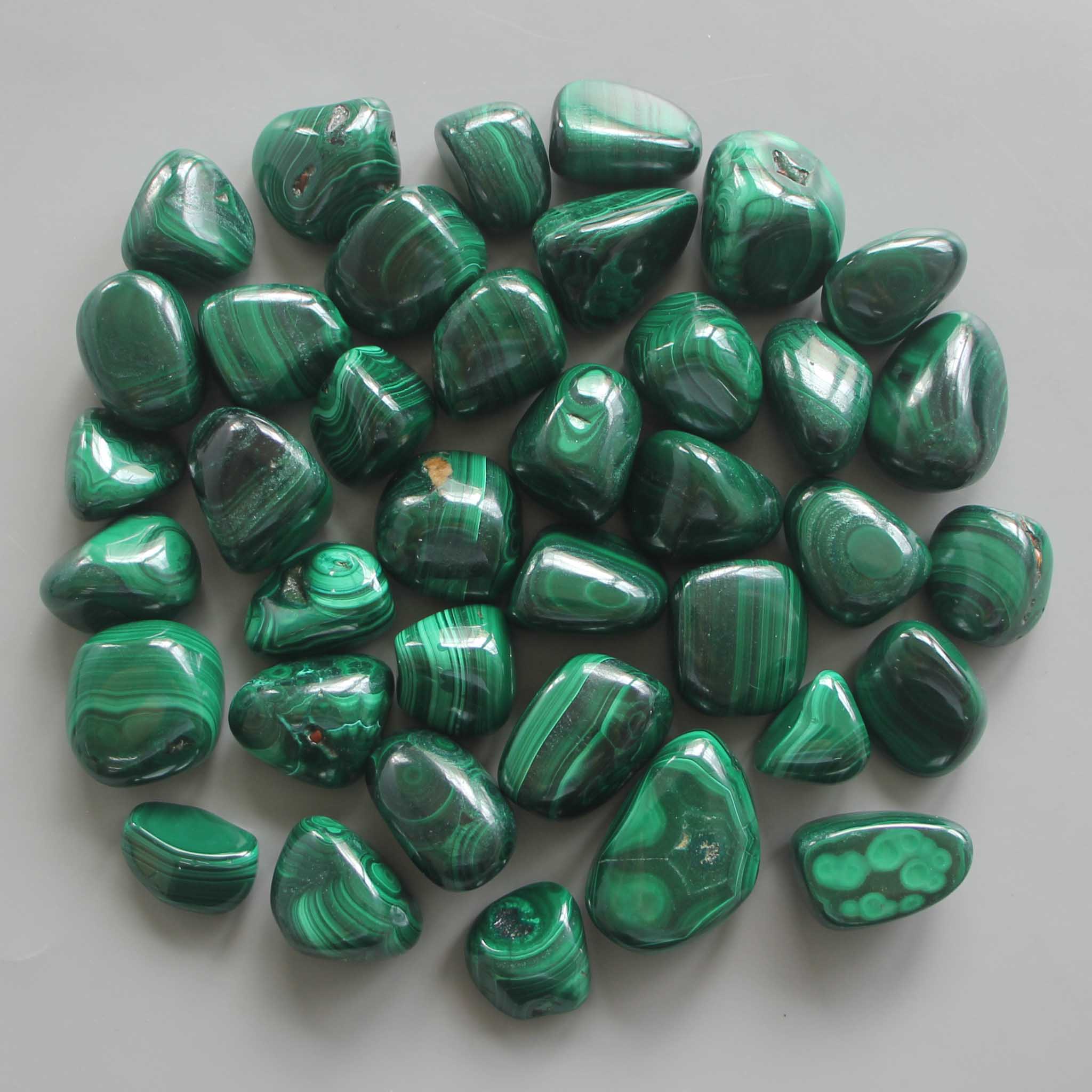 814be9e10c6961b8a4285cc9bd83ac58_9efdde62-e555-4b66-bb31-34ff741ca229 Malachite Tumble Stone 1 inch (2-3cm) A