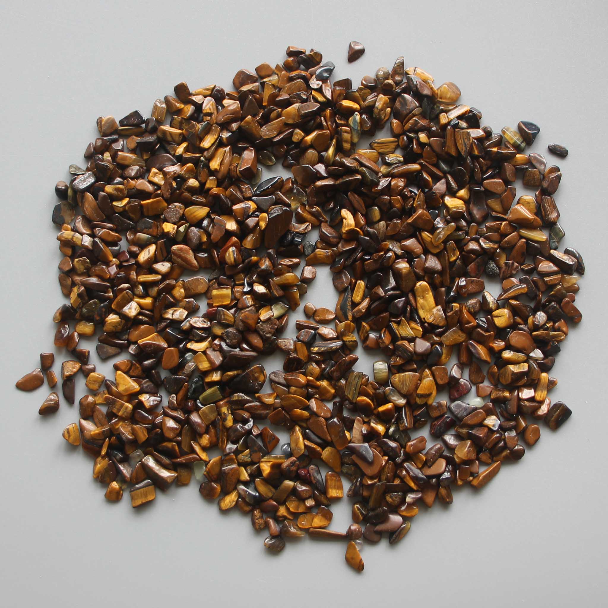 b0434c3fa80c8f224c25e95ddf2b009f_aca6f518-d705-4a07-b2c0-d81d3eeab213 Golden Tiger Eye Chips With Corner 0.2 inch (3-8mm) A/B