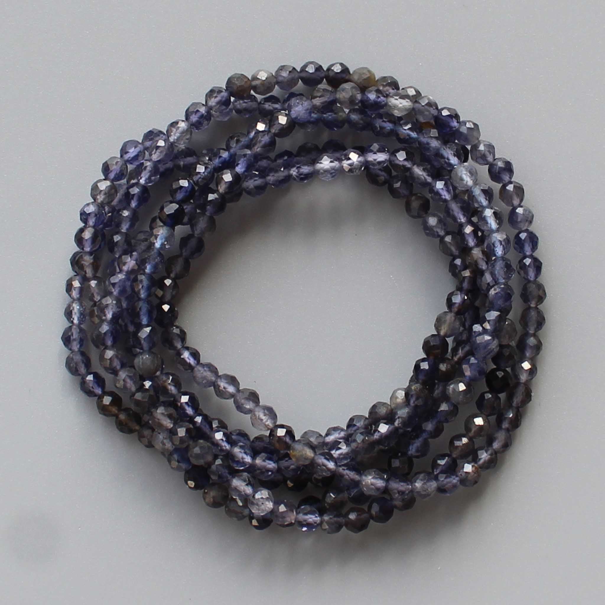 b77be25e1acdbb4ddd4110b2d4e17aa1-1 Iolite Faceted Round Bracelet 4mm A+/AA