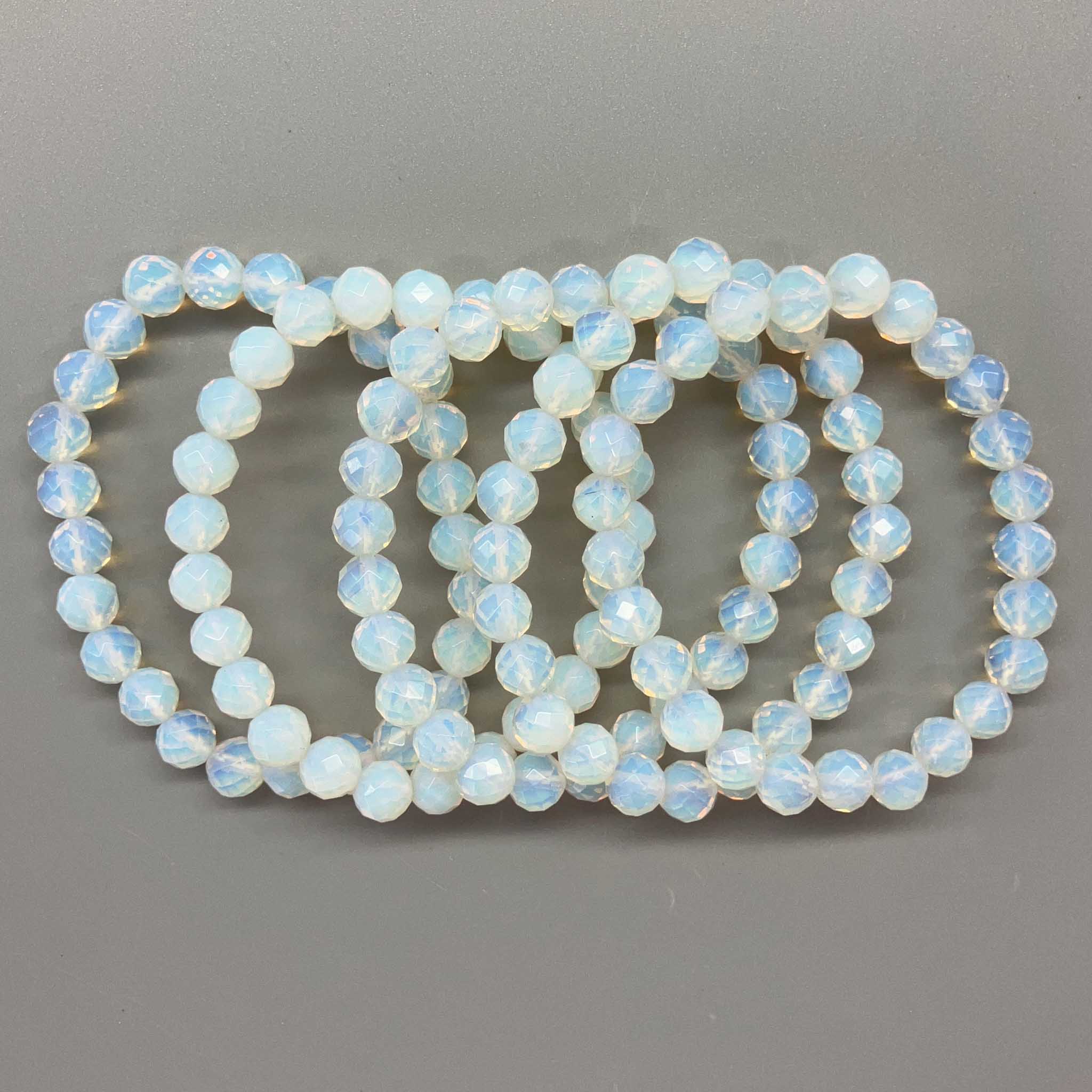 c2770fe6768c64c66914da292964c11a_97e11a68-4f4f-424b-945f-a6a3d7696c11 Opalite Faceted Round Bracelet 8mm A