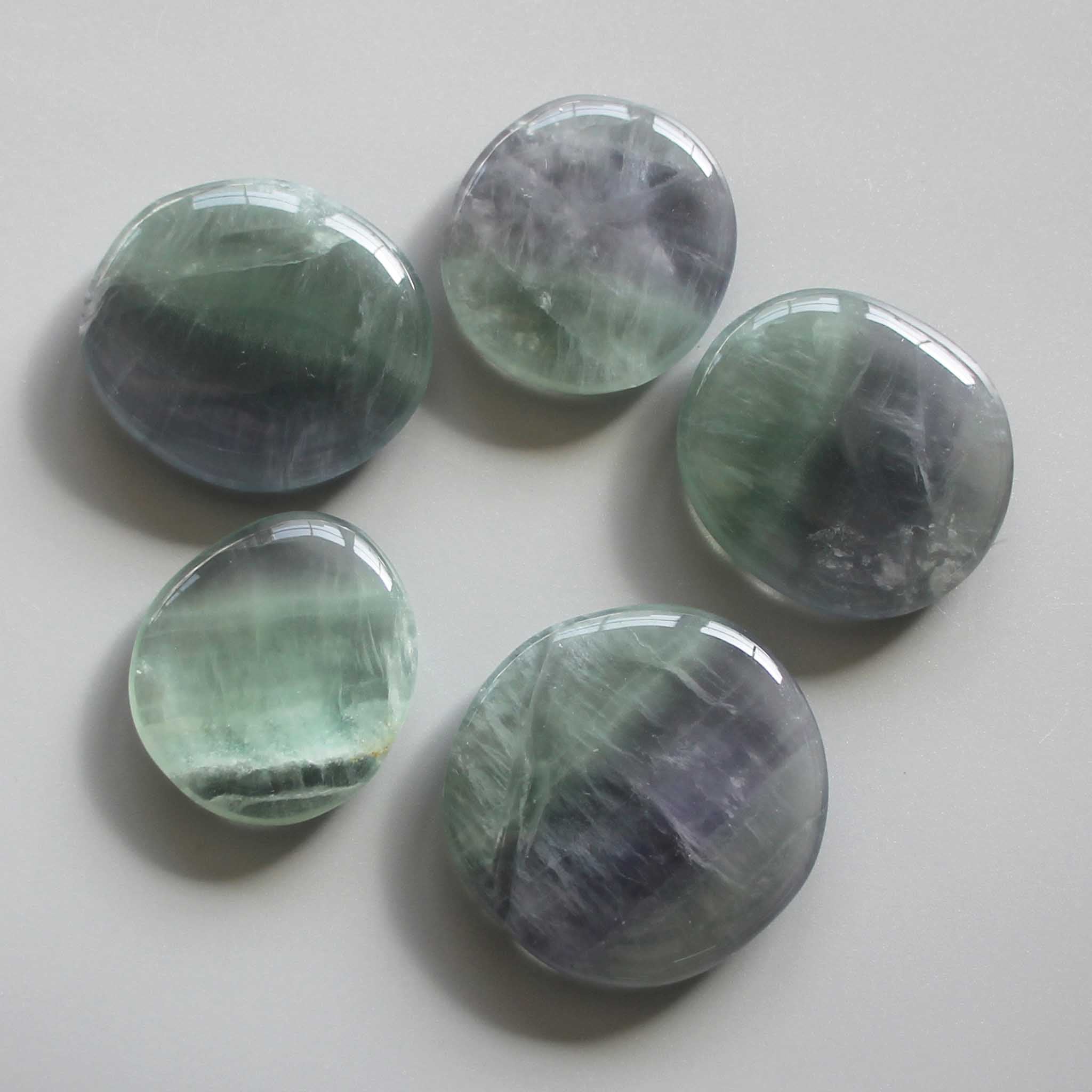 337fb14d0b388235405bb362490d0a12 Violet Fluorite Smooth Stone 1.6 inch (0.8-1 x 3.5-4.5cm) A-/B+