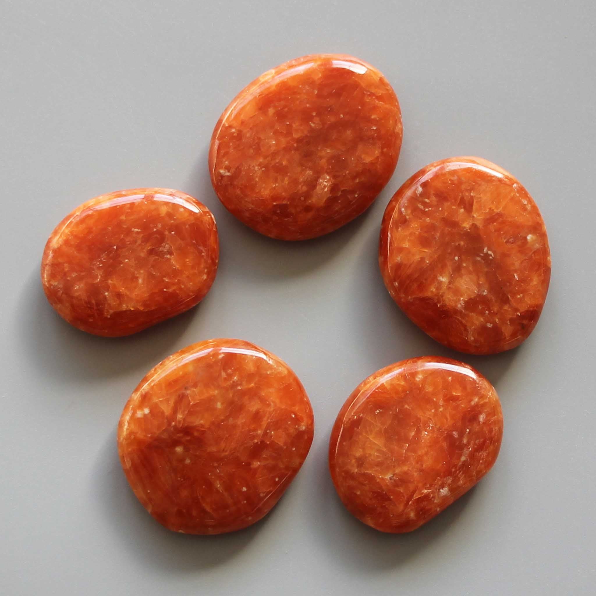 6a8b66e67e2828bfebee0123fab4d67c Orange Calcite Brazil Smooth Stone 1.6 inch (0.8-1 x 3.5-4.5cm) A+/AA